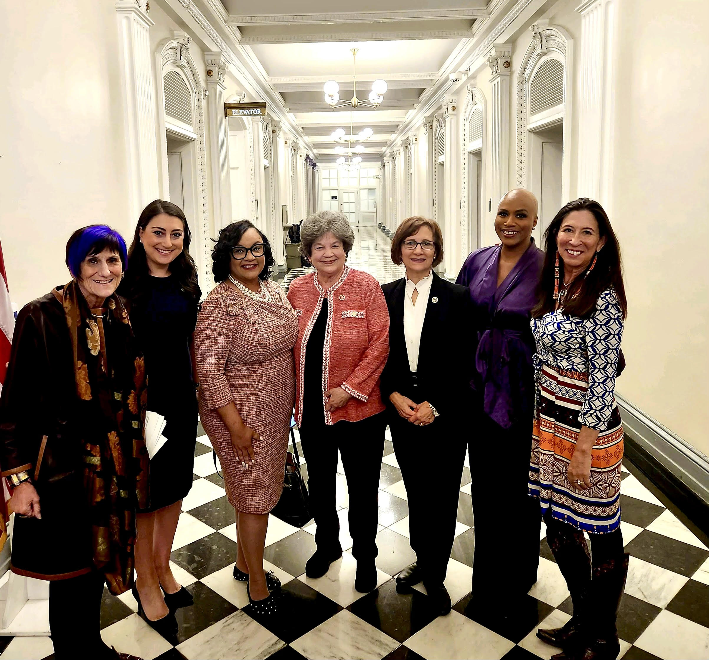 TLF stands next to her DWC colleagues